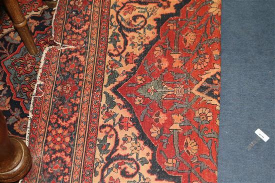 A Persian red ground rug 194 x 137cm